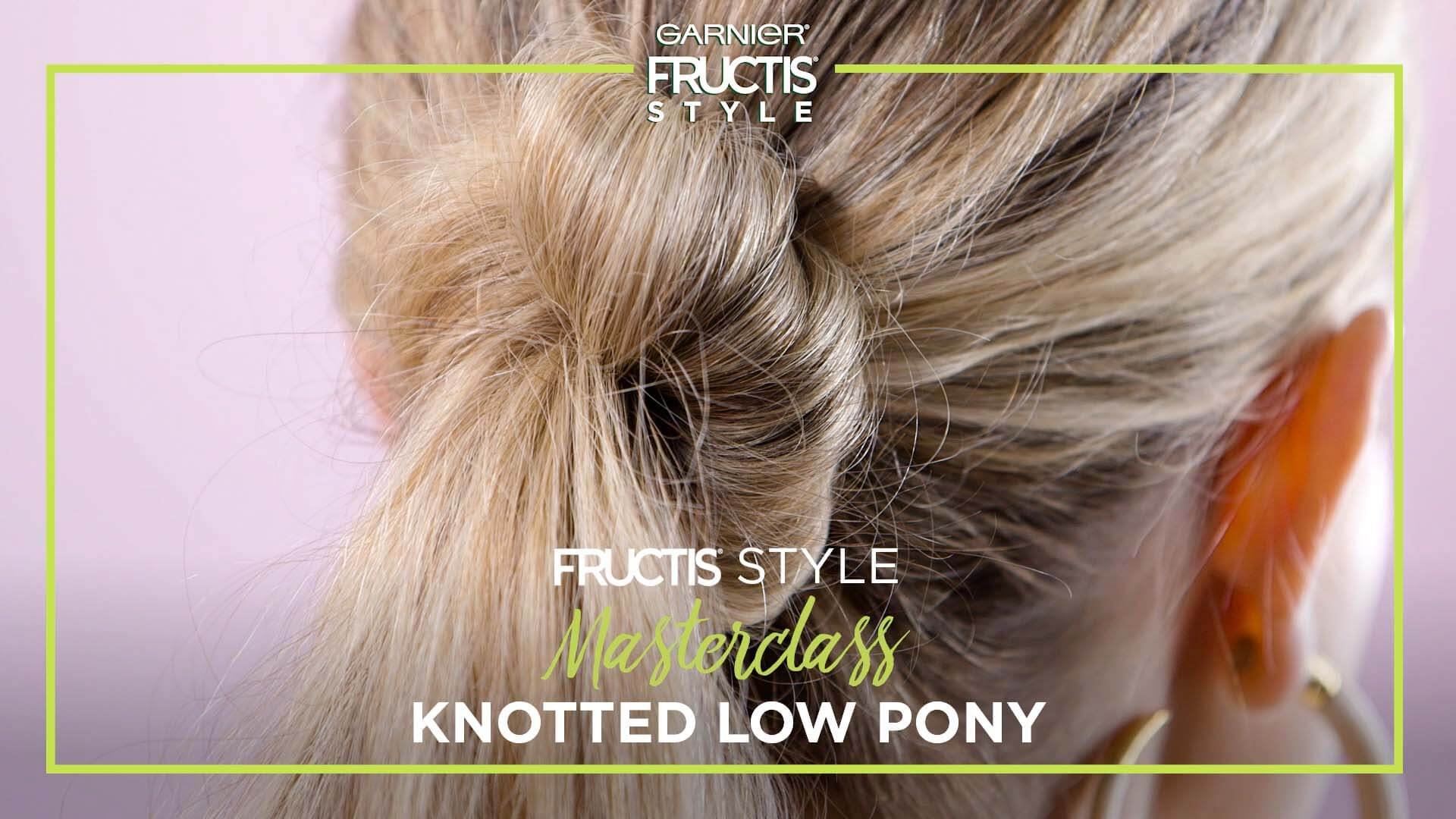 The back of a girl's head displaying the Knotted Low Pony hairstyle.